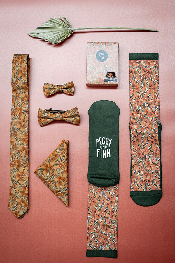 Explore our Flowering Gum Terracotta Collection, featuring accessories adorned with vibrant terracotta and pink flowering gum motifs. This collection beautifully blends earthy tones with floral elegance, perfect for adding a warm, natural touch to any ensemble