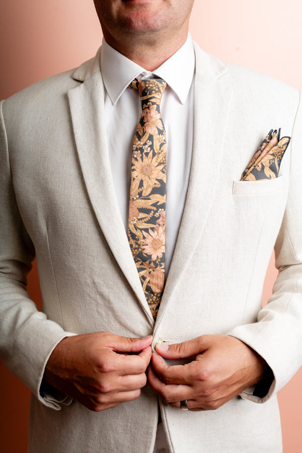 100% cotton tie showcasing a beautiful range of natives like Banksia and Waratah, ideal for special events and everyday elegance