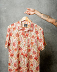 Hanging casual shirt in nude with red, pink, and green floral accents