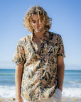 Men's short sleeve shirt featuring an Australian native floral print with banksia and waratah motifs on a dark base