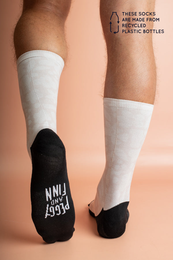 Soft and durable socks in a unique floral cut-out pattern, crafted from recycled bottles to combine fashion with sustainability