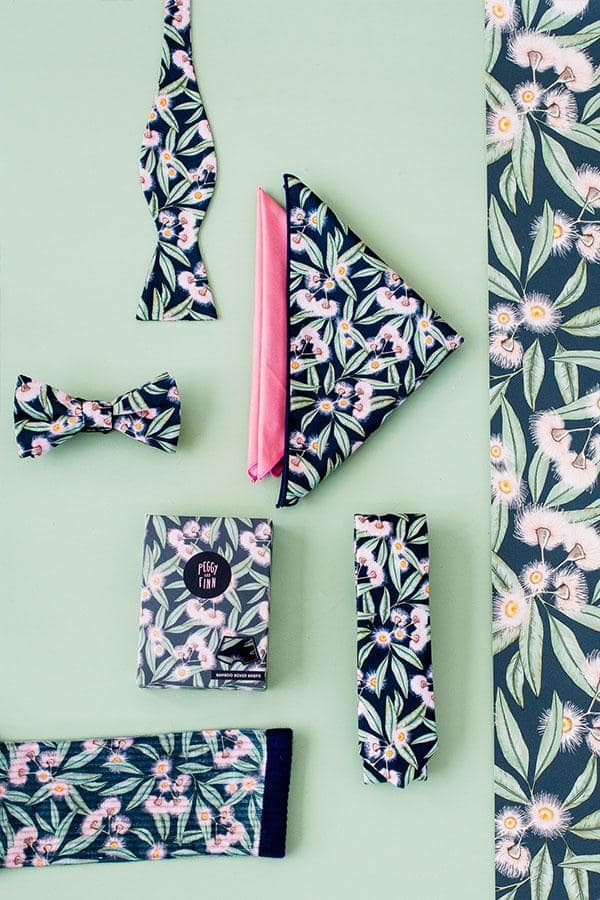 Discover our Flowering Gum Collection, featuring a range of accessories adorned with the iconic Australian flowering gum motif. Each piece combines vibrant pink blossoms with lush greenery, perfect for adding a touch of natural elegance to your style