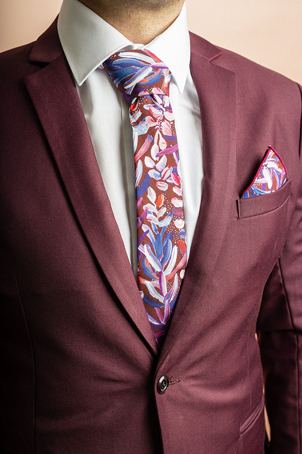 Stylish cotton tie showcasing a vibrant protea design in burgundy, ideal for formal occasions and nature lovers