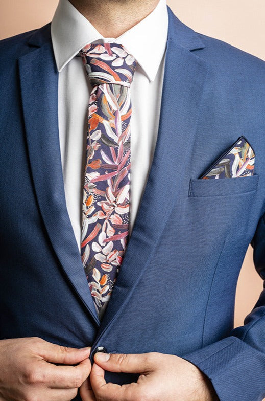 Elegant navy pocket square adorned with a white and pink protea floral design, perfect for adding a sophisticated botanical touch to formal wear