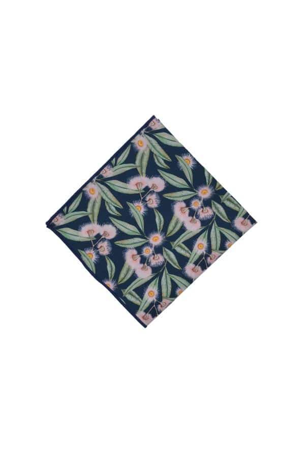 Stylish 100% cotton pocket square adorned with flowering gum motifs, blending pink and green hues against a soft blue base, ideal for weddings and special occasions