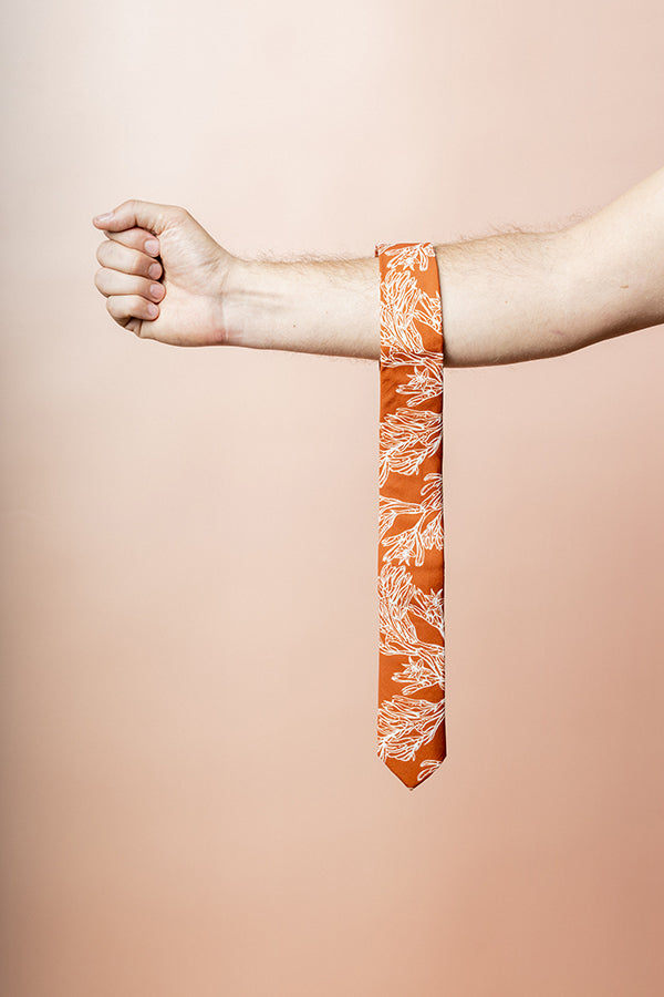 Stylish, modern and elegant burnt orange tie with kangaroo paw motif for formal wear