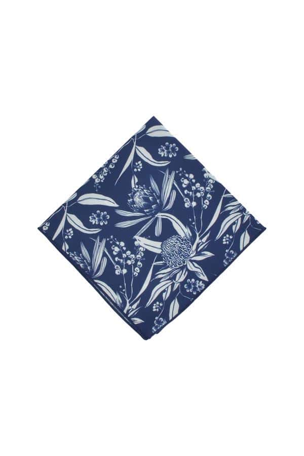 Elegant navy pocket square featuring a pattern of white native Australian flora, perfect for adding a sophisticated touch to formal outfits